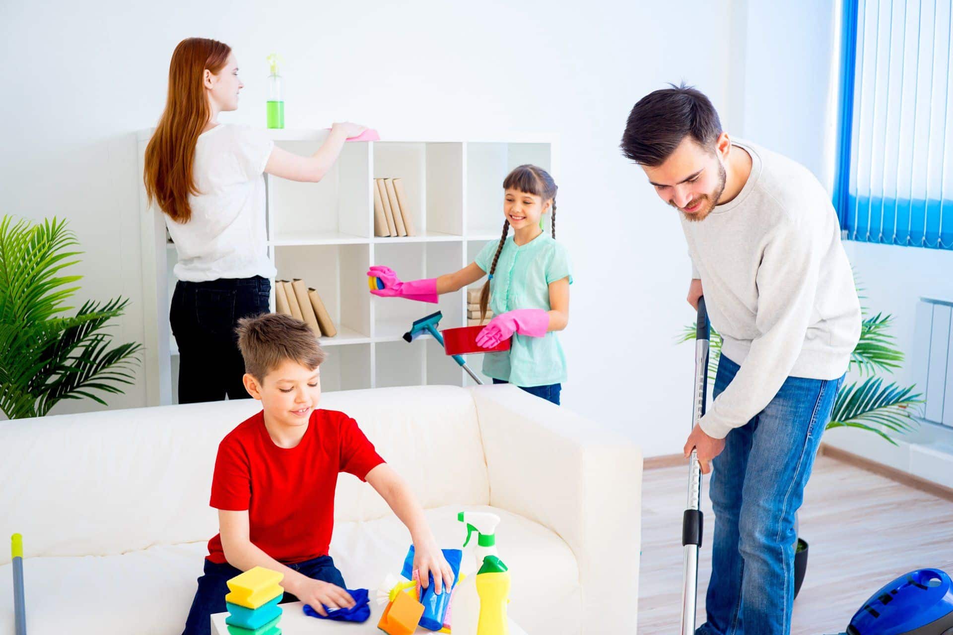 7 Cleaning Resolutions to Start Your New Year Off Right 2 family of 4 cleaning a living room together