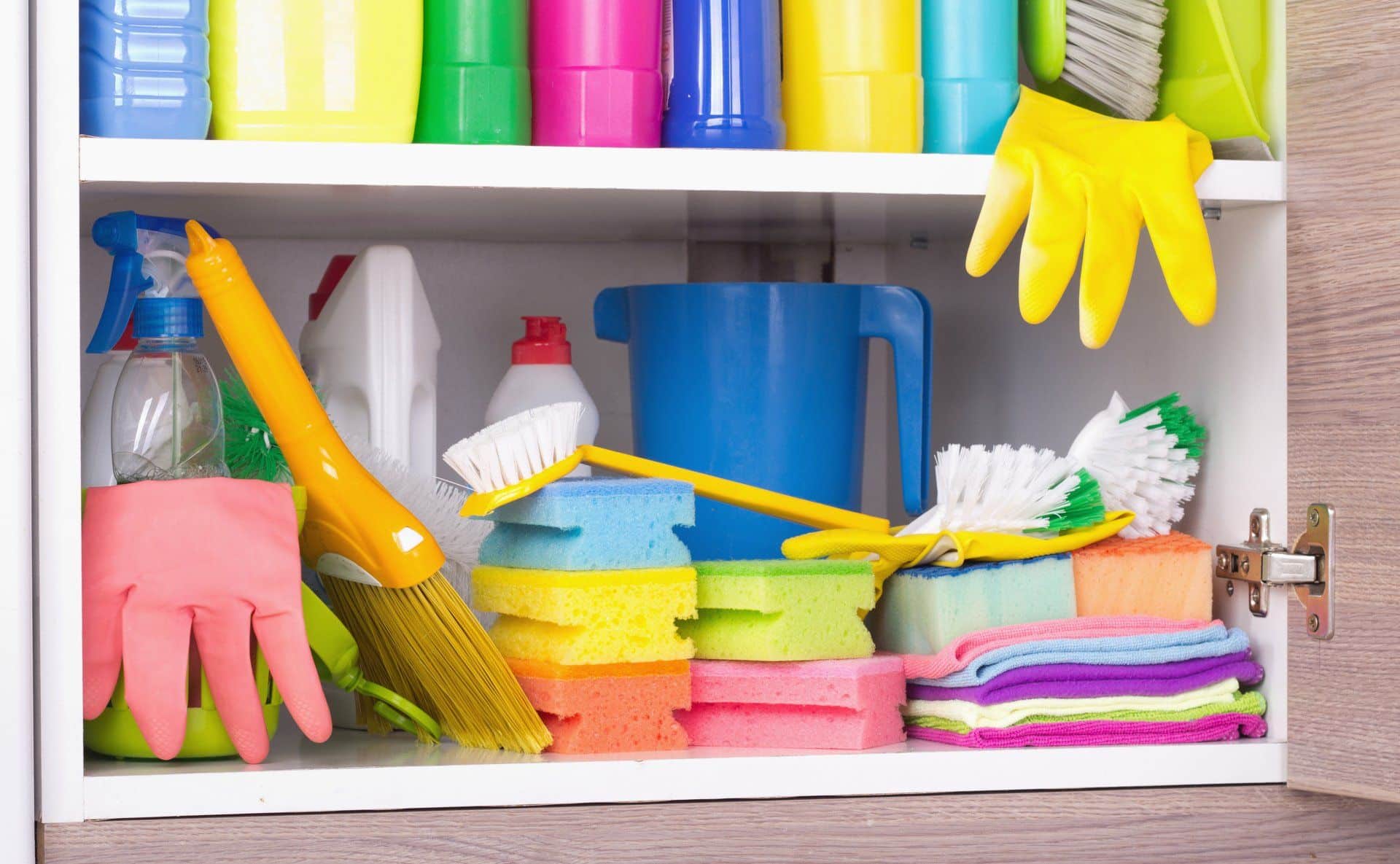 cleaning tools and supplies stored in a cabinet