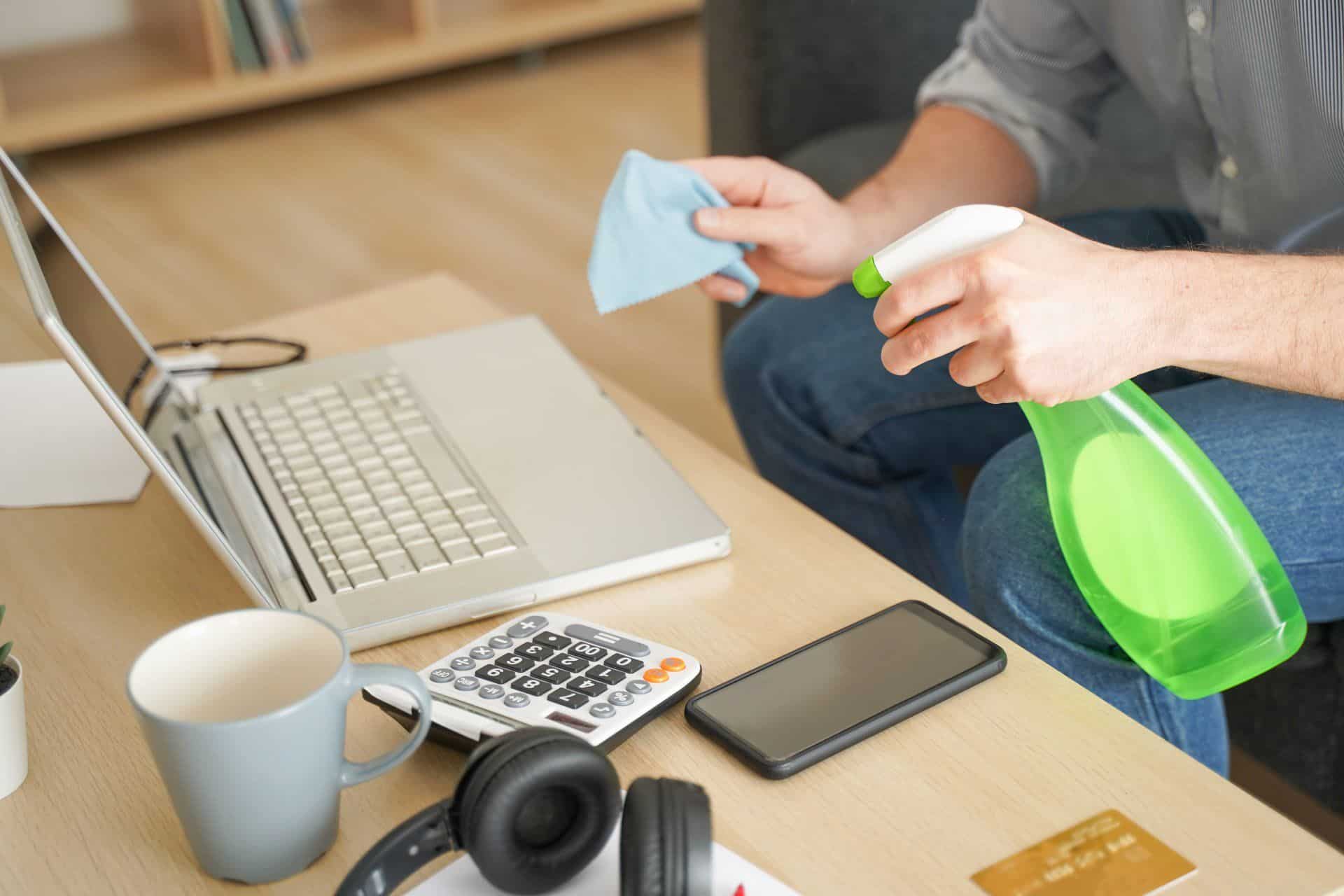 9 Things You Can Clean While Working Remotely 4 a man cleaning his laptop