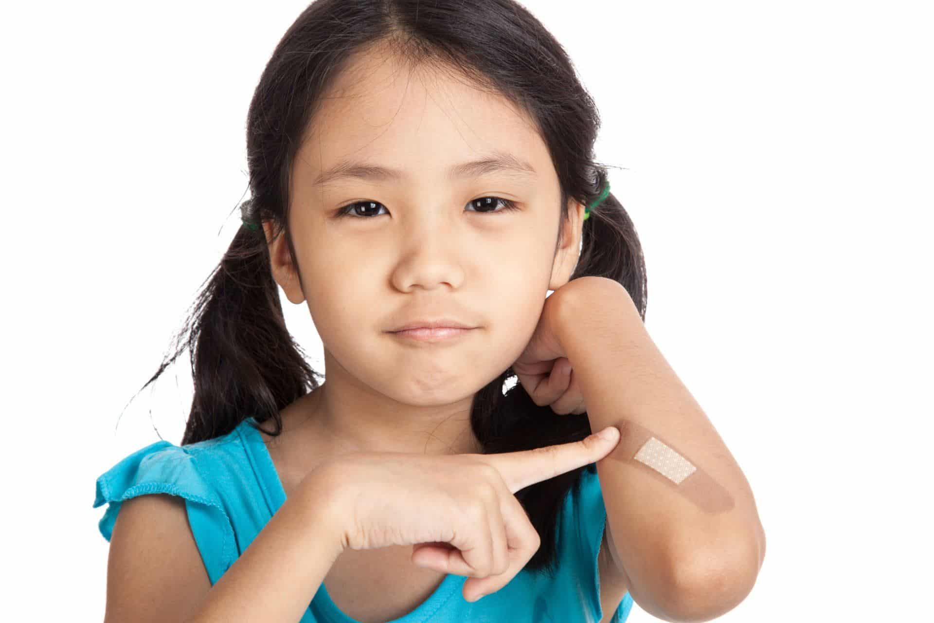 How to Remove Set-In Stains in Your Carpet 7 young girl pointing to a band aid on her elbow