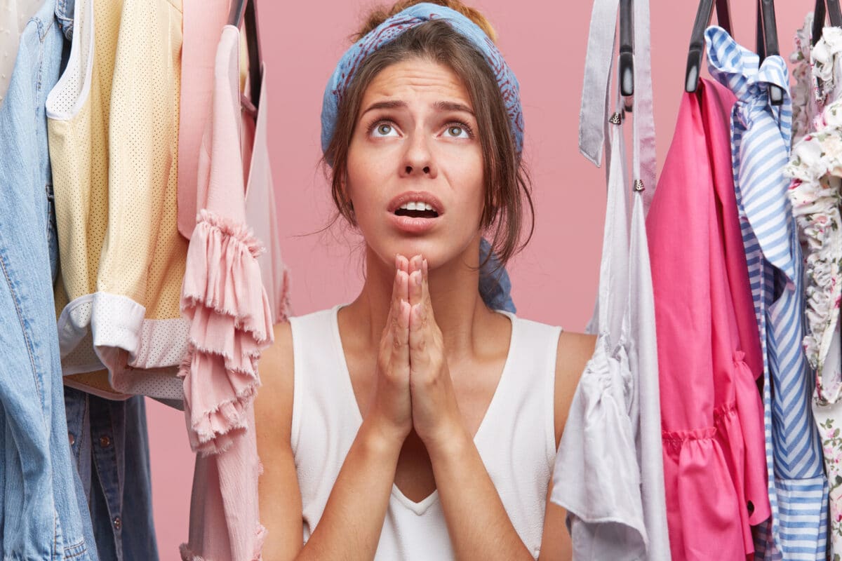 a woman praying in her hall closet