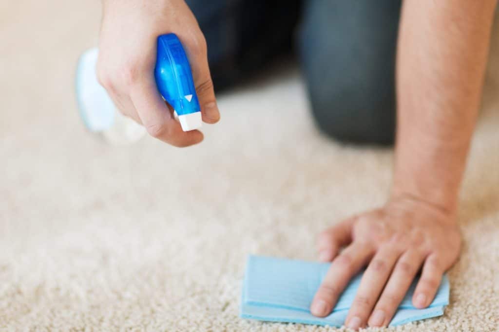 How to Get Nail Polish Out of Carpet 3 A man doing a patch test on his carpet when figuring out how to get nail polish out of carpet