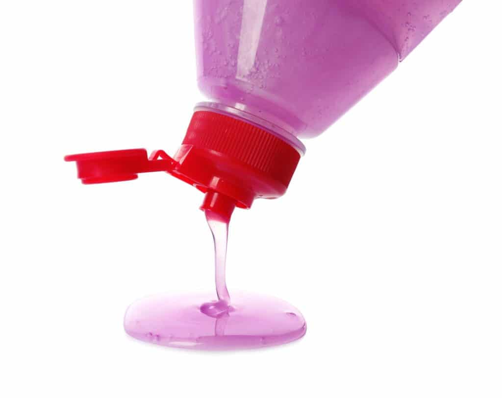 How to Get Nail Polish Out of Carpet 8 Purple dish soap being poured out of the plastic bottle
