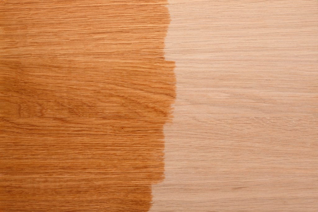 Hardwood floors with polish on the left side, and unpolished on the right.